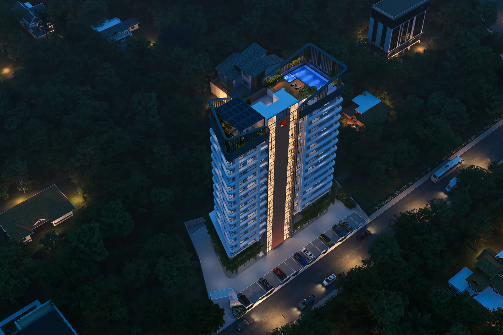 An aerial of the site after dark: the lit tower standing among low roofs, gardens and the roads that reach it.