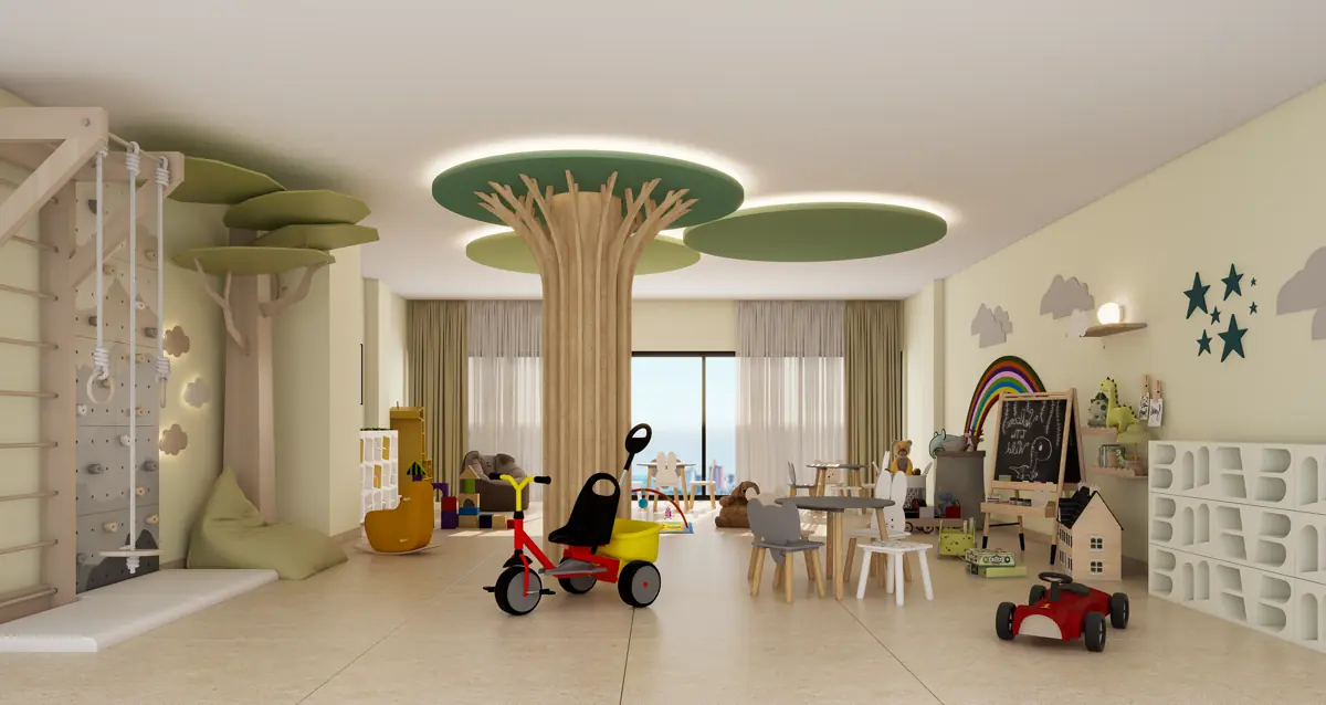 The indoor games and play room, with soft flooring, low seating and storage along one wall.