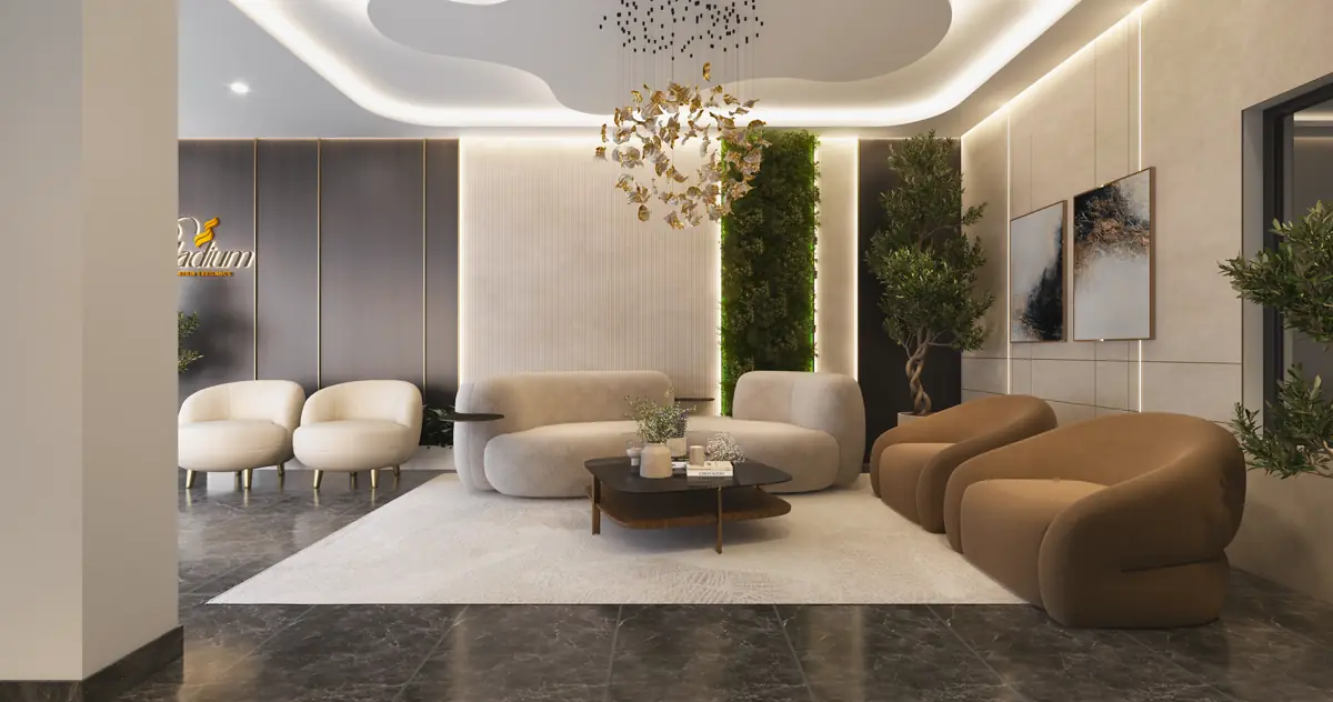 The entrance lounge with soft seating, a decorative screen and planting against a double height wall.