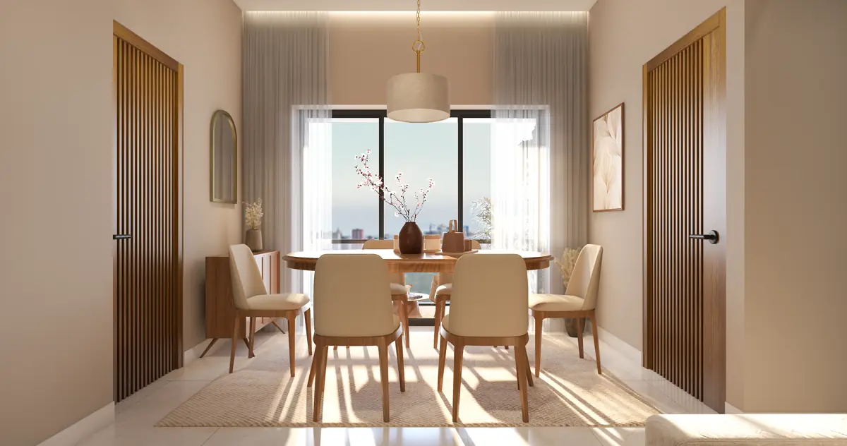 The dining area with a table under a pendant light, framed by a timber door and a panelled wall.