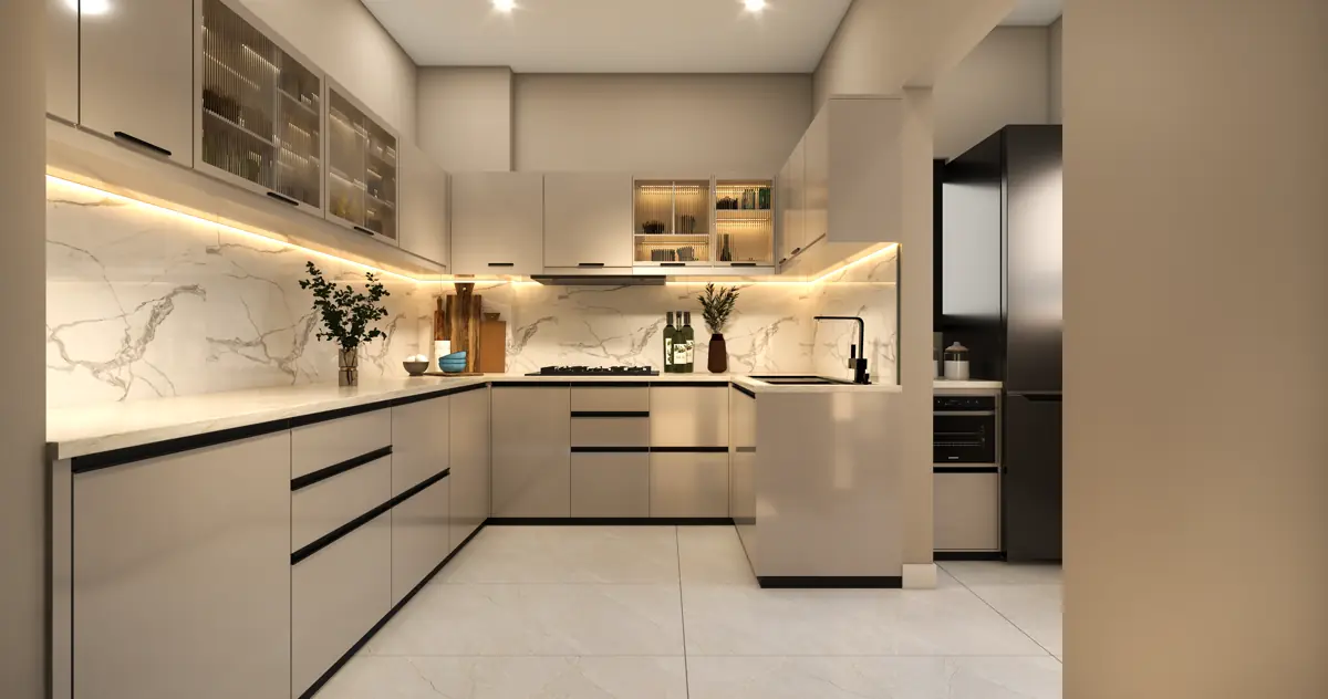 The kitchen, with a run of counter under a window and provision for a washing machine and dishwasher.