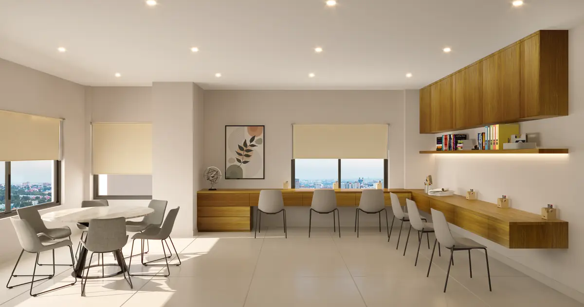A study with a long desk under a window, shelving along the wall and a chair at each end.
