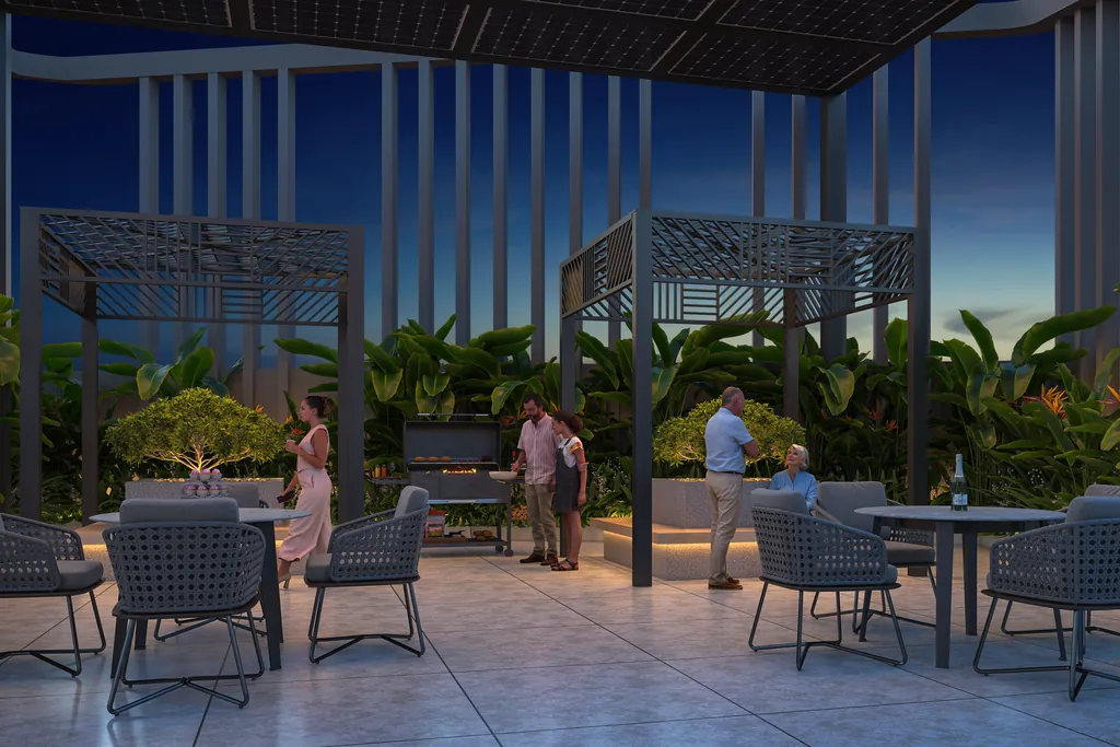 The rooftop terrace at night, with pergolas, planting and seating laid out along the deck.